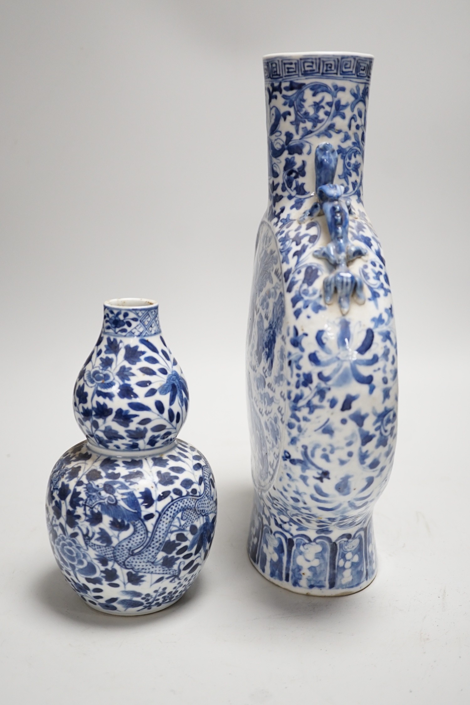 A Chinese blue and white moonflask and a similar double gourd vase, 19th century, moon flask 31cms high